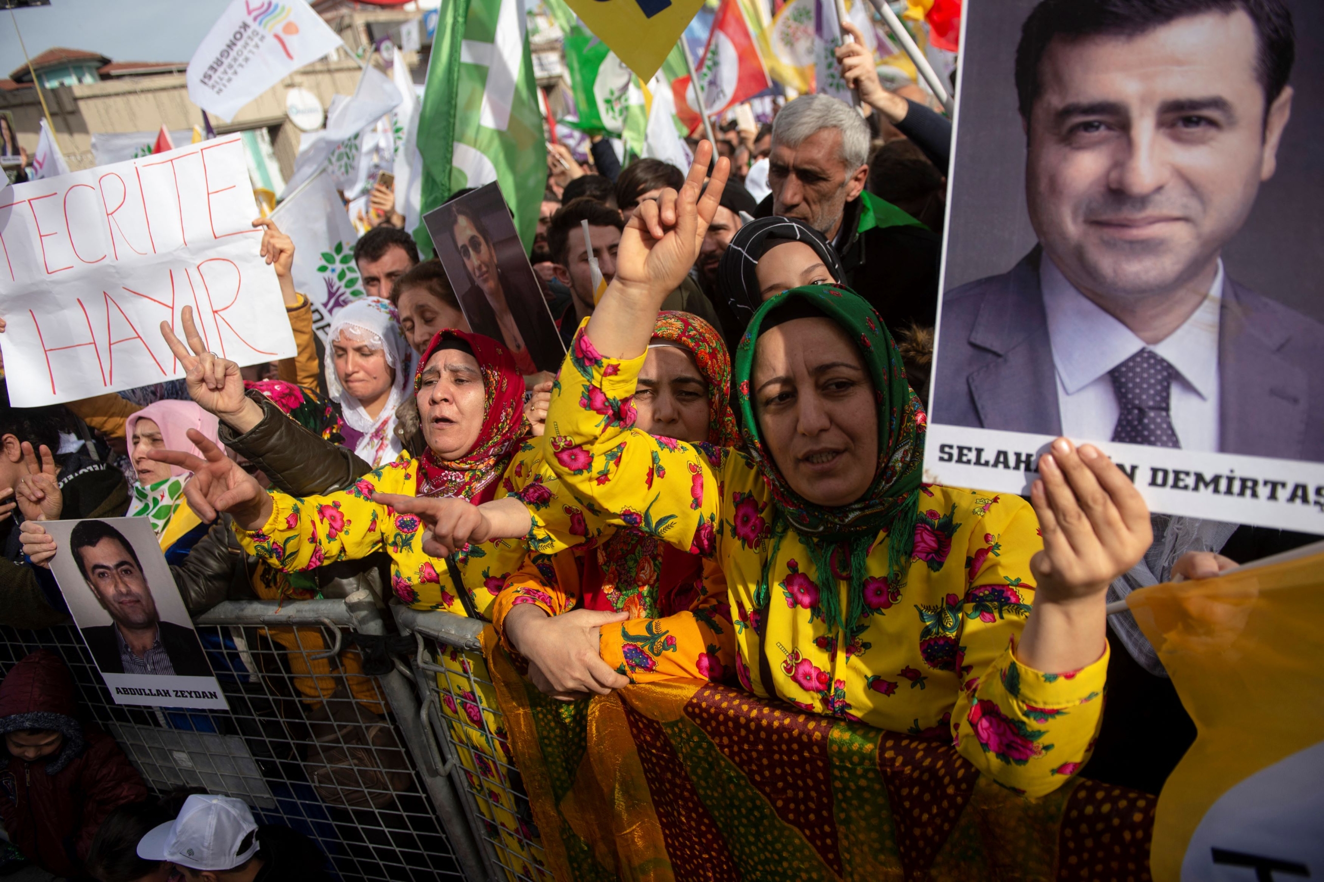 Supporters of the pro-Kurdish Peoples' Democratic Party (HDP) hold a picture of jailed former party leader Selahattin Demirtas as they attend a 'Peace and Justice' rally in Istanbul on February 3, 2019 (AFP)