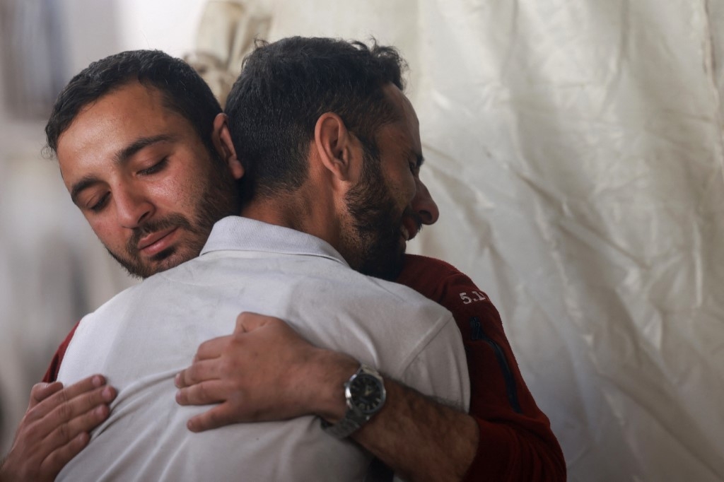 Palestinians mourn relatives killed in Israeli bombardment, at the al-Najjar hospital in Rafah in the southern Gaza Strip, on April 25, 2024 