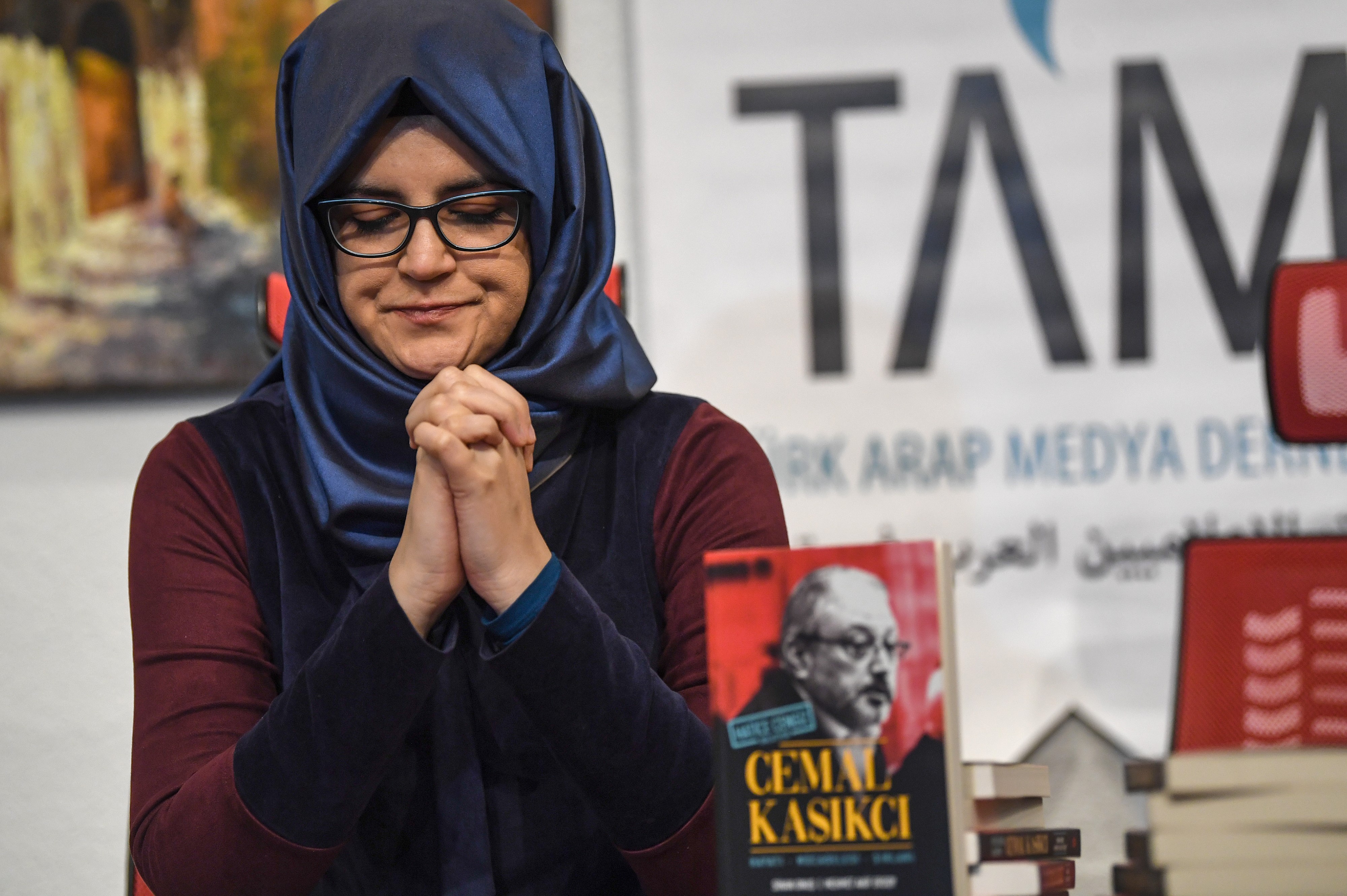 Hatice Cengiz, fiancee of Jamal Khashoggi sits next to her book on February 8, 2019 during a presentation press conference of a book named "Jamal Khashoggi" in Istanbul (AFP)