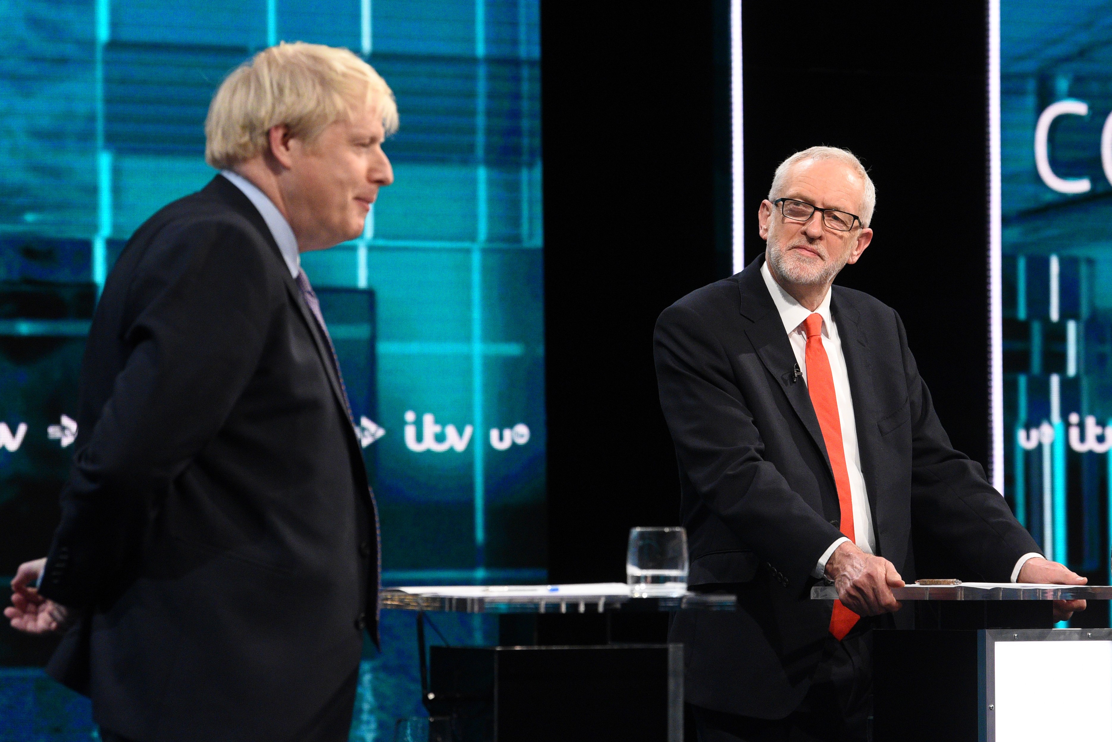  Britain's Prime Minister Boris Johnson (L) and Britain's Labour Party leader Jeremy Corbyn (R) as they debate on the ITV Debate on 19 November (AFP)
