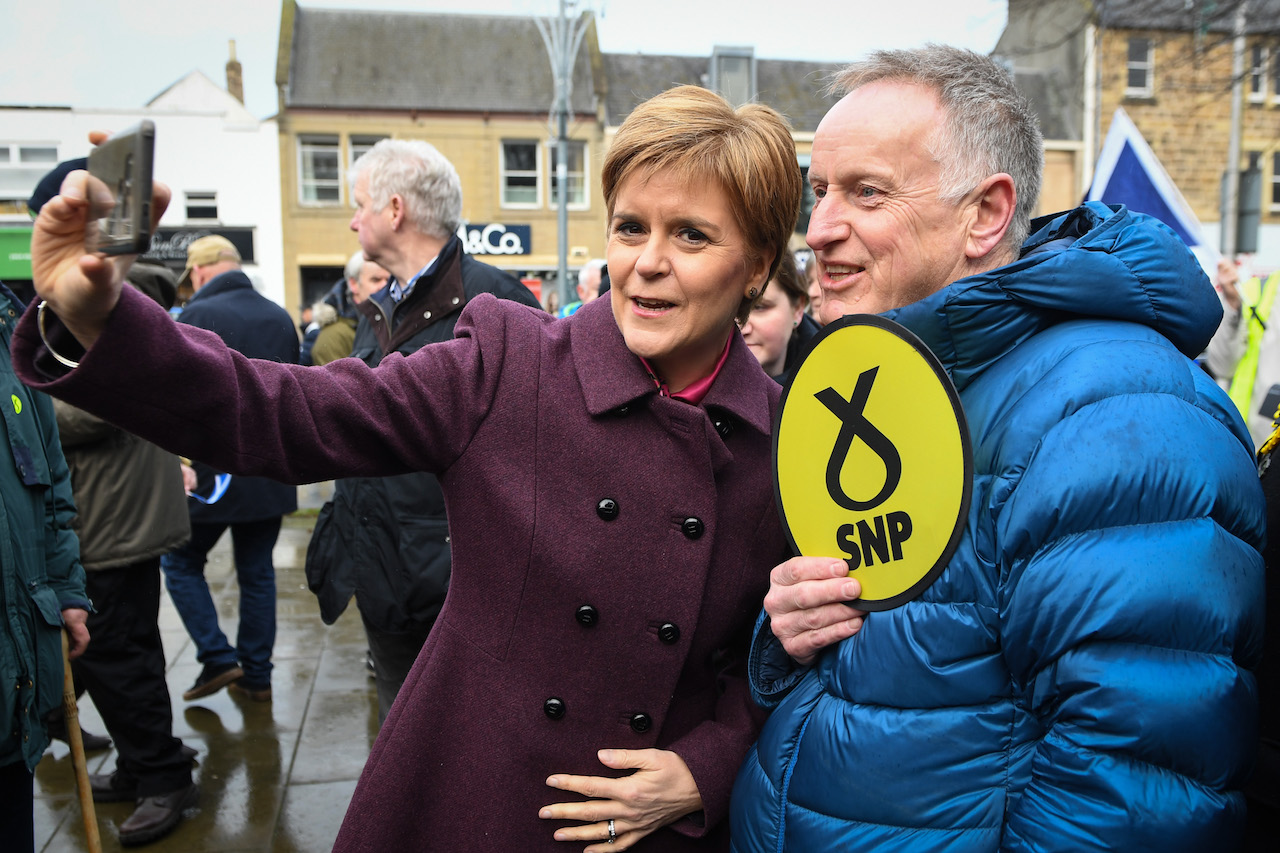Scottish National Party (SNP) leader Nicola Sturgeon greets supporters in Dalkeith while on the campaign trail (AFP)