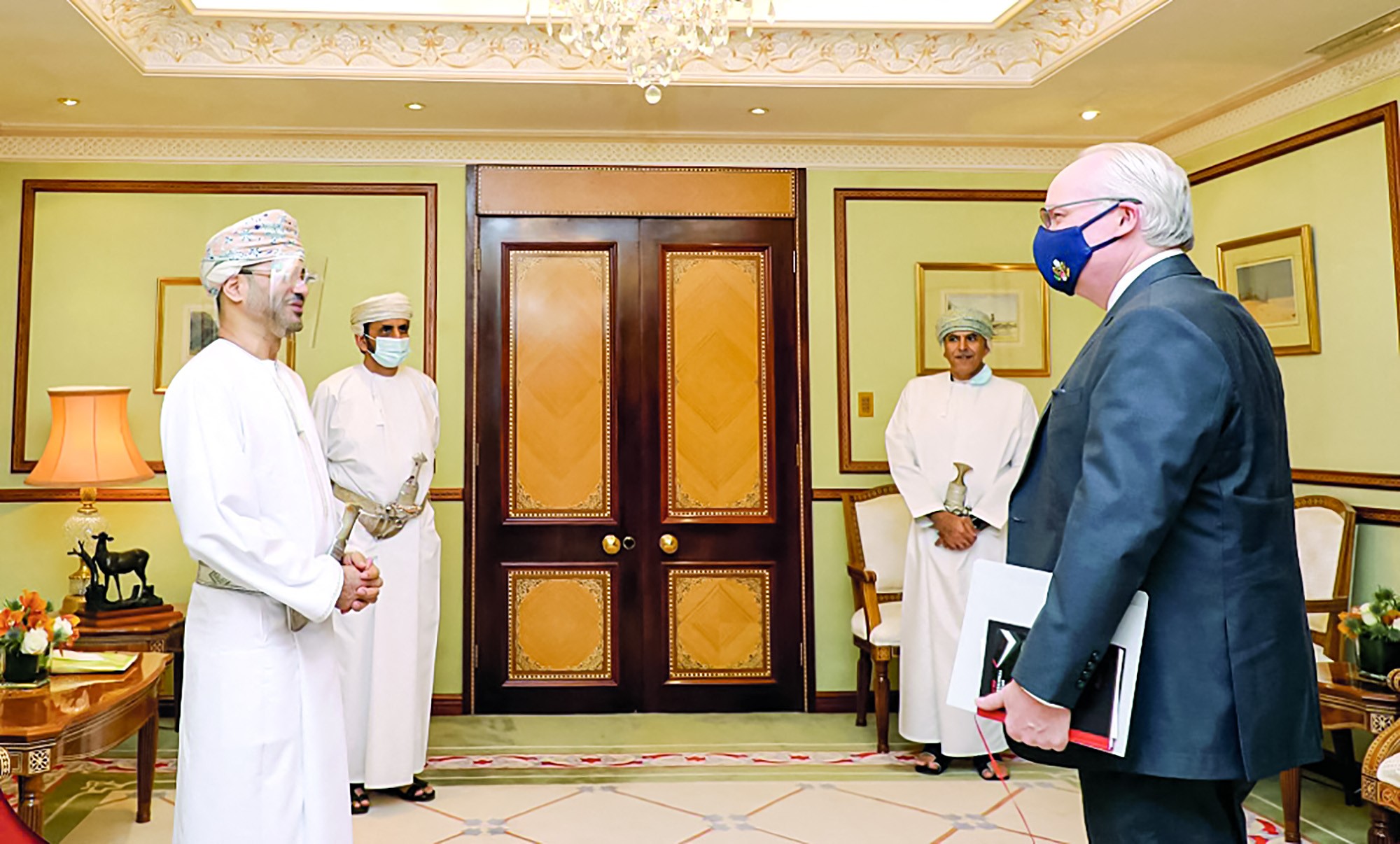 Oman's Foreign Minister Badr bin Hamad bin Hamood al-Busaidi receiving the US Special Envoy for Yemen Tim Lenderking in the capital Muscat (AFP)