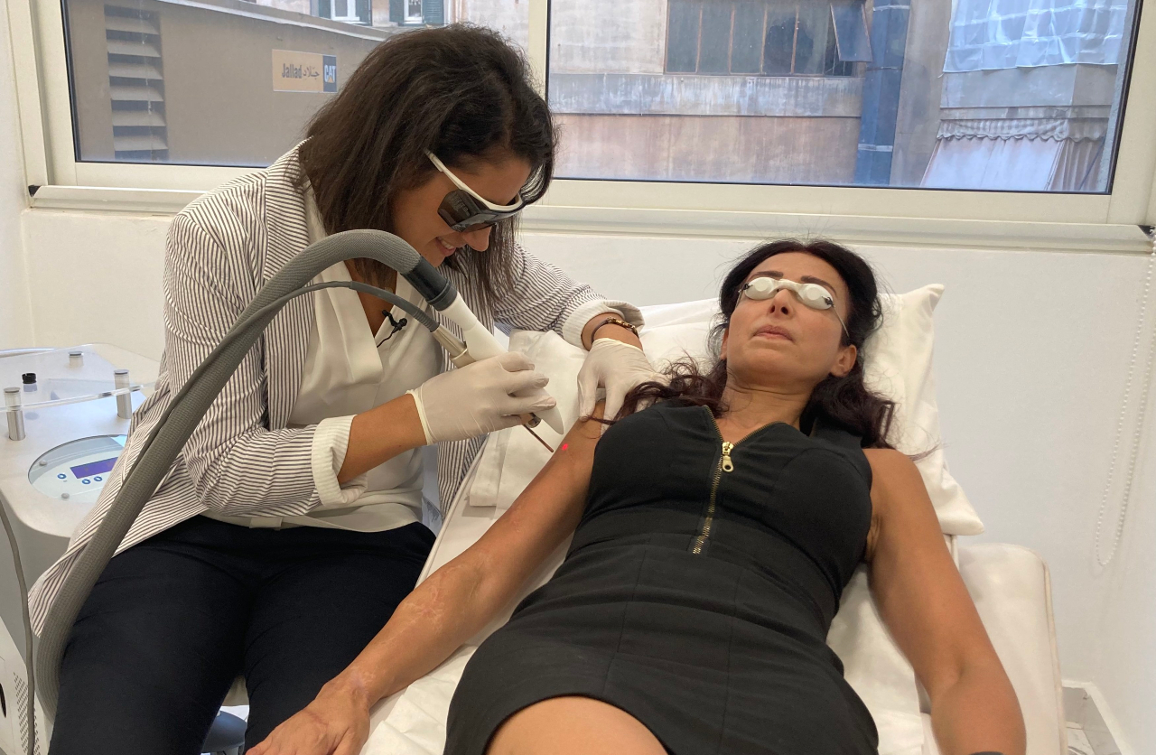 Ritta Hanna, right, during her session laser session with dermatologist Maya Habre (MEE)