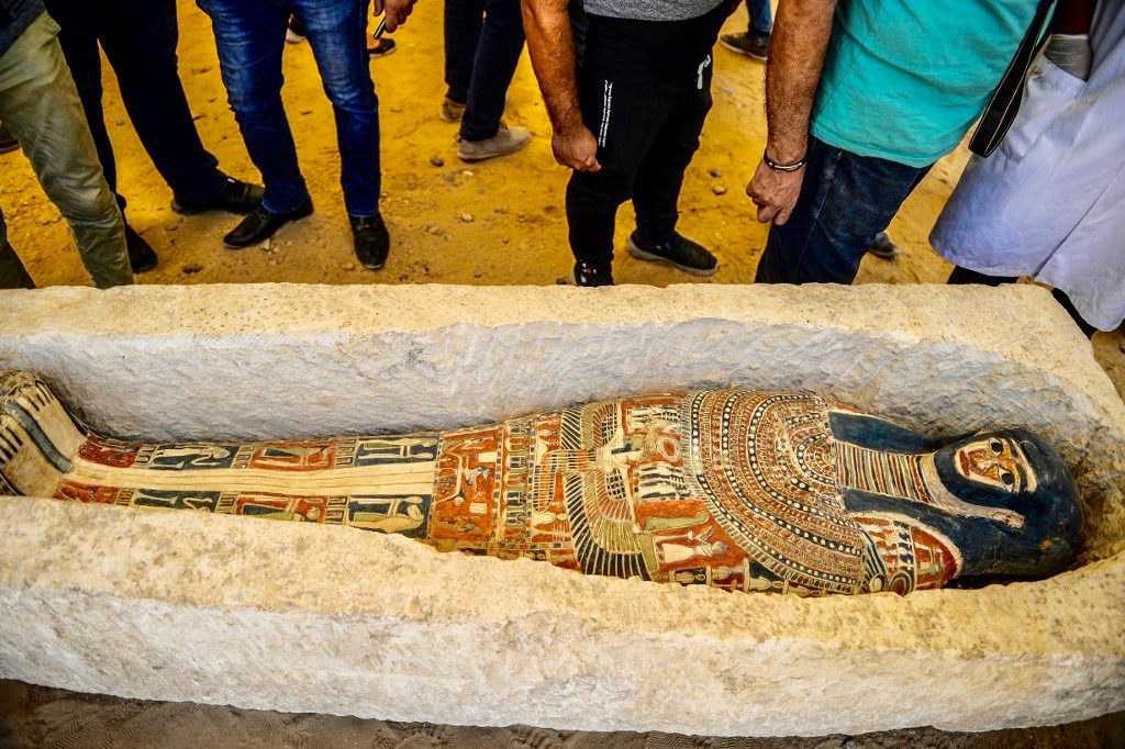 Sarcophagus discovered at Dahshur necropolis is examined near Bent Pyramid on Saturday (AFP)