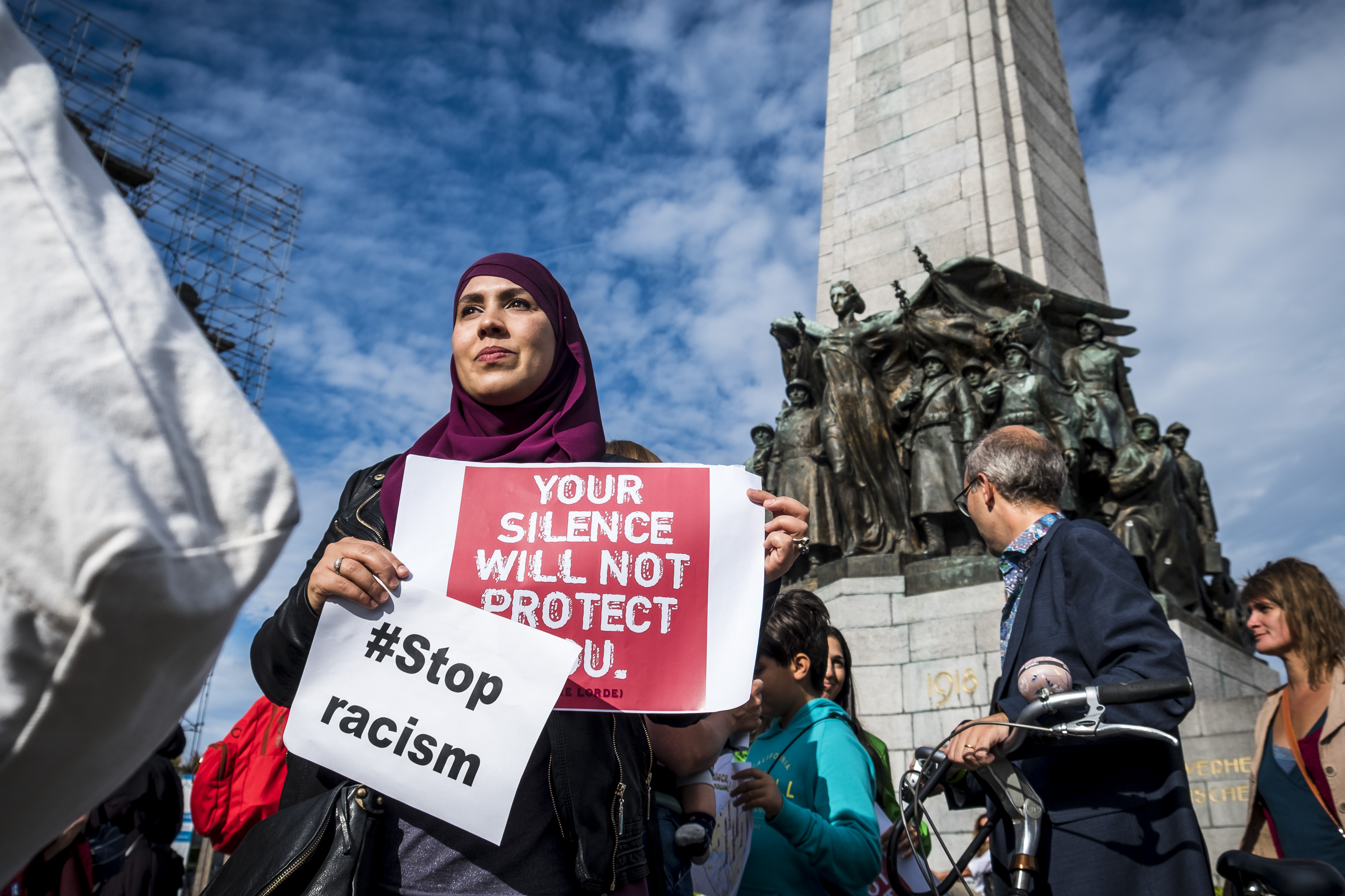 People hold posters as they protest against 'hate and islamophobia' in Brussels (AFP)