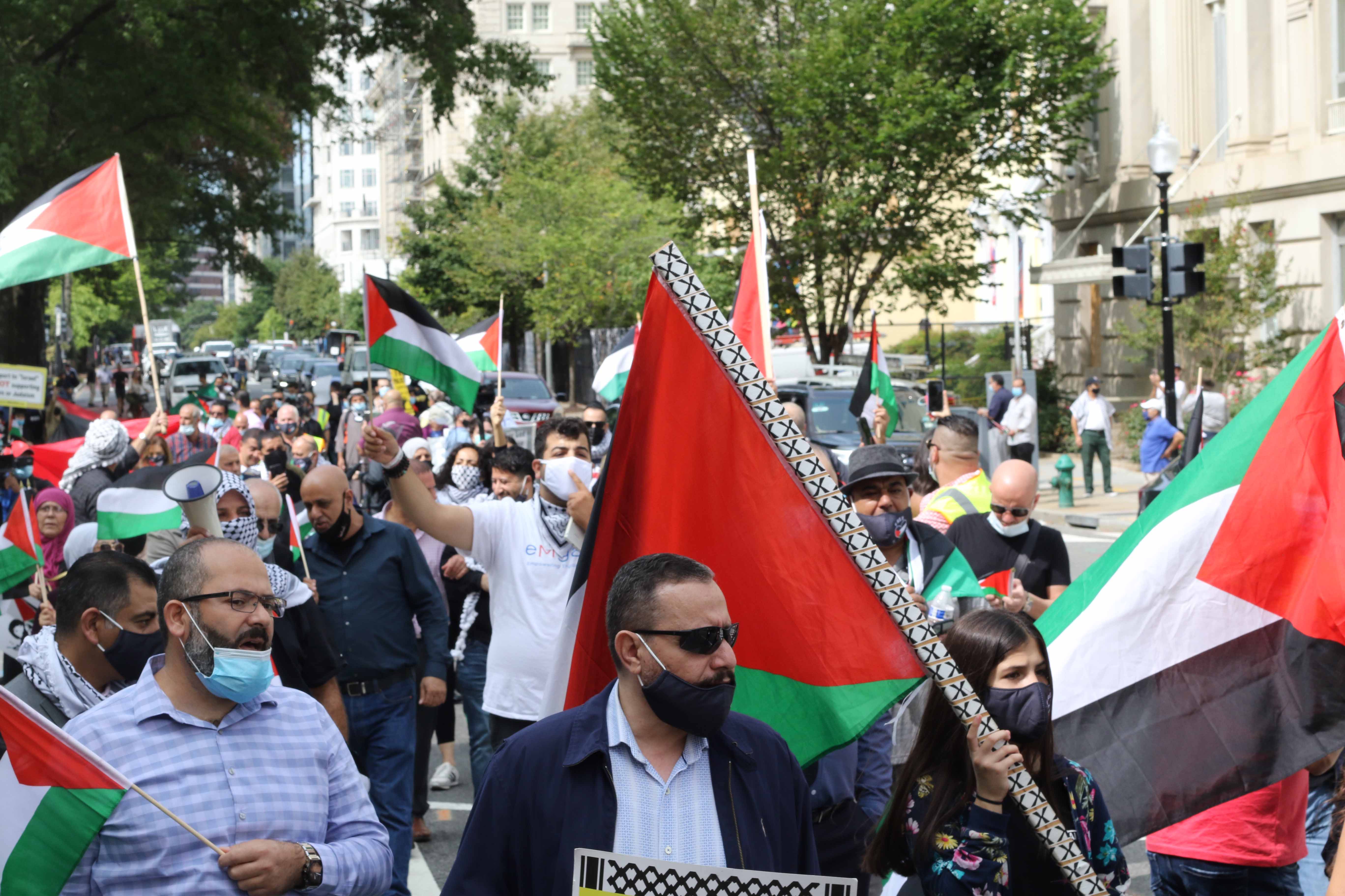 Palestinians march in Washington DC outside the White House.