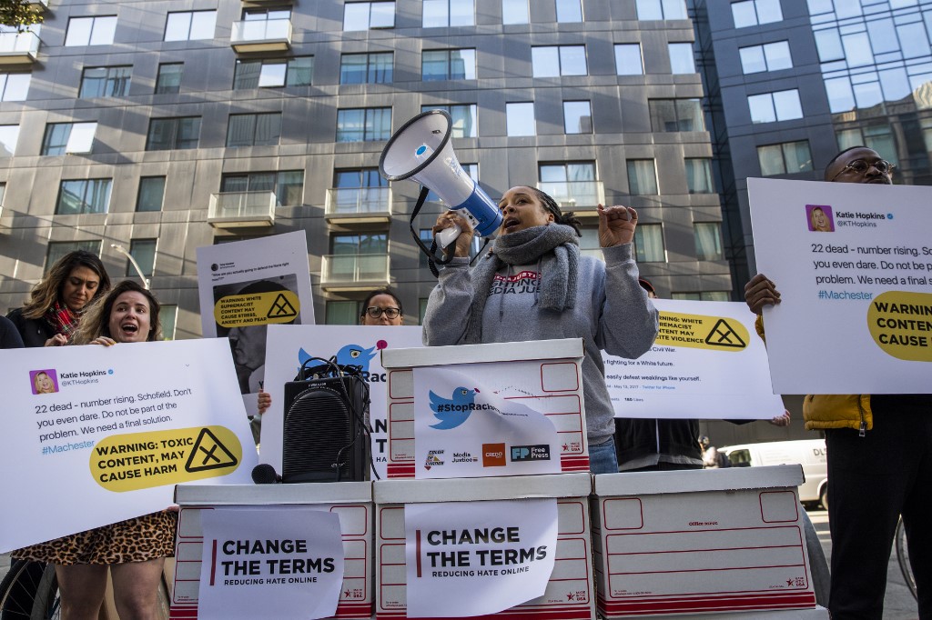 Activists protest the spread of online racism in California on 19 November (AFP)