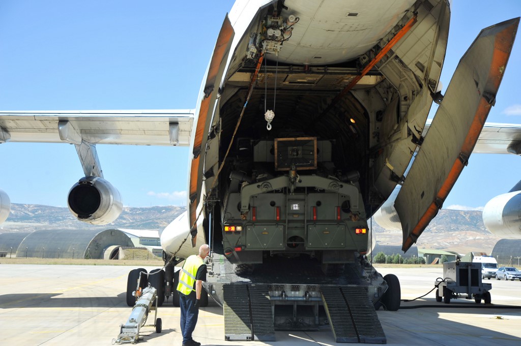 A Russian military cargo plane carrying the S-400 missile defence system is unloaded northwest of Ankara on 27 August (Handout/Turkish Defence Ministry/AFP)