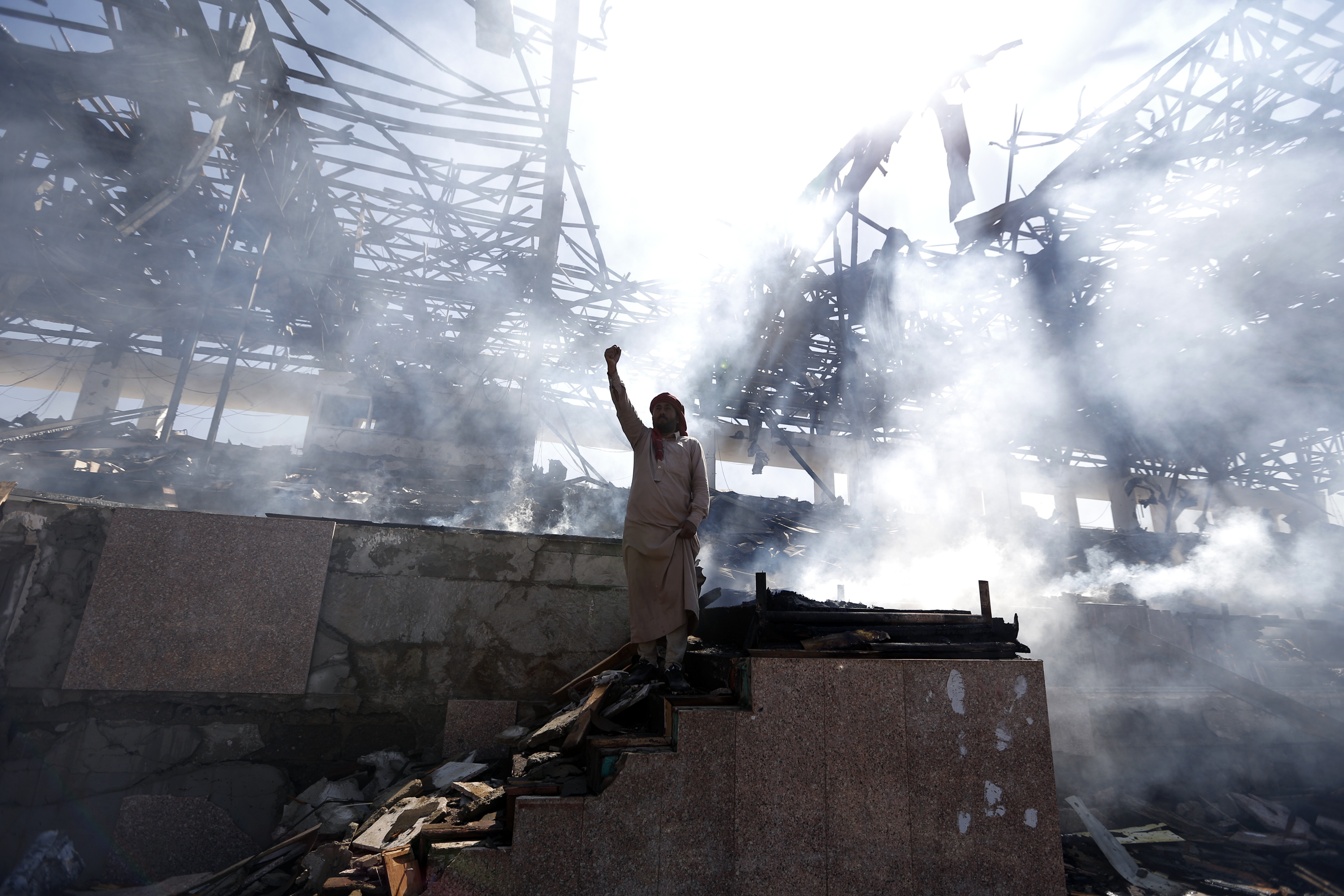 A Yemeni man gestures at the site of an air strike in the capital Sanaa, on November 5, 2017. 