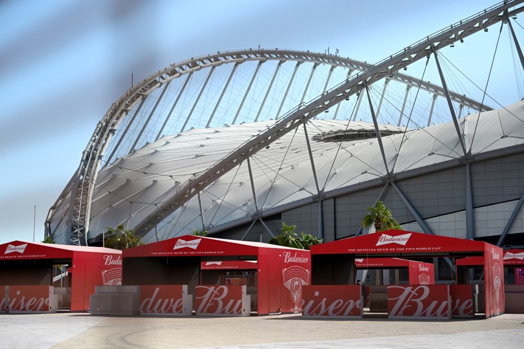 Budweiser beer kiosks are pictured at the Khalifa International Stadium in Doha on 18 November 2022 ahead of the Qatar 2022 World Cup football tournament (AFP)