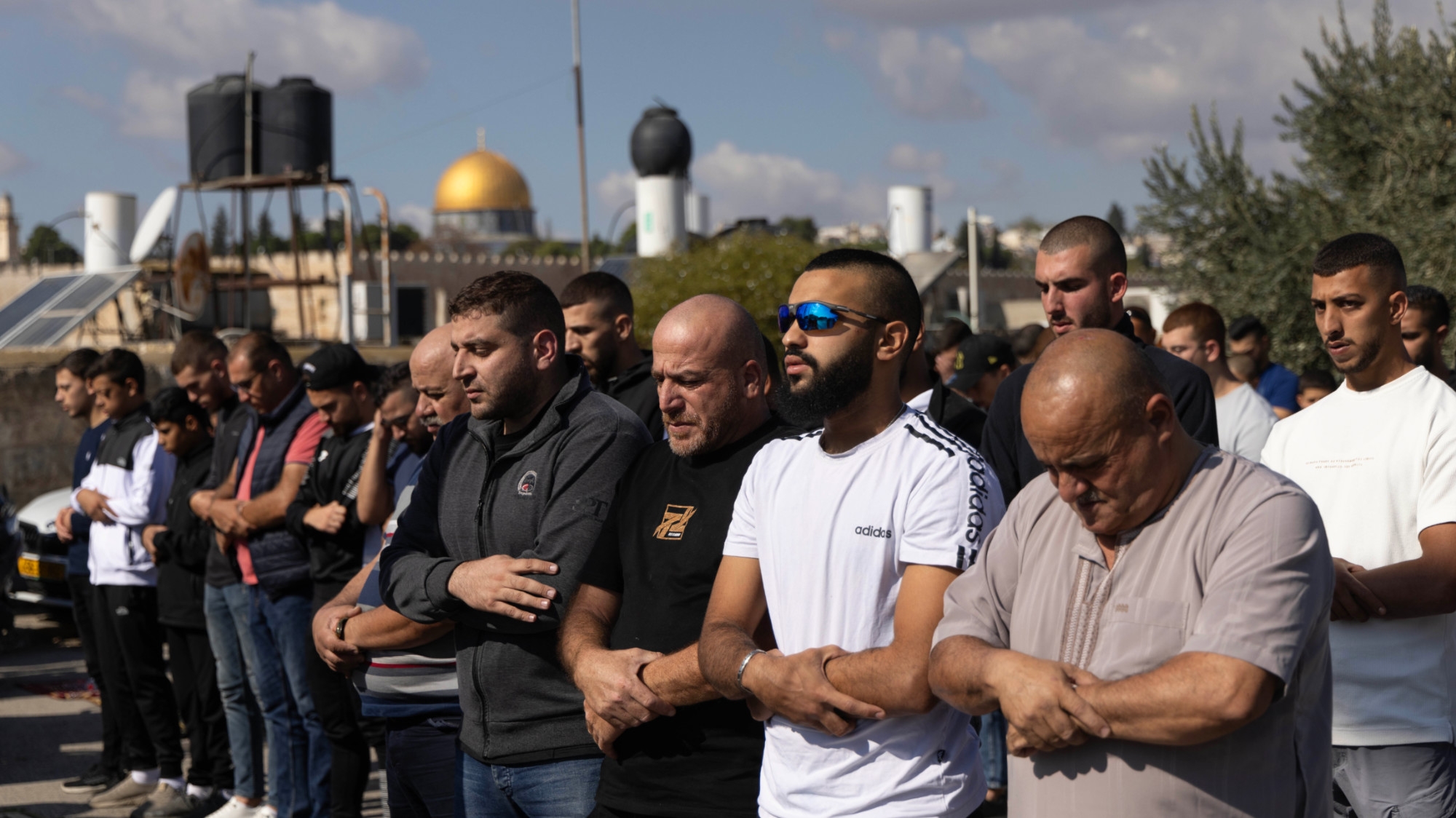 Palestinians forced to pray outside Al Aqsa Mosque in occupied East Jerusalem on 17 November amid Israeli restriction (MEE/Faiz Abu Rmeleh).