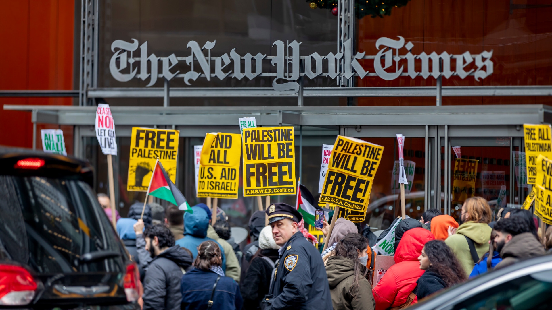 Pro-Palestine protesters gather outside the offices of The New York Times to challenge the newspaper's coverage of Israel's war on Gaza during a global call to 'strike for Palestine' on 11 December 2023 in New York City (Michael Nigro/Sipa USA via Reuters)