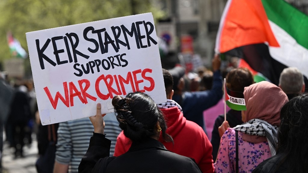Protesters in central London call for a Gaza ceasefire on 13 April 2024 (Justin Tallis/AFP)