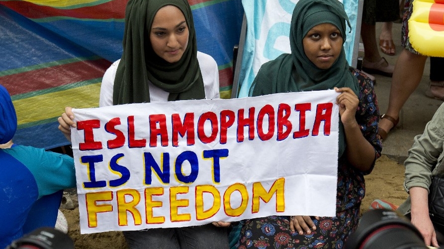 Protesters hold a sign denouncing Islamophobia in August 2016 in London (Justin Tallis/AFP)