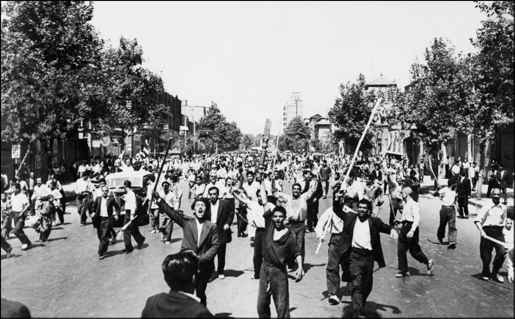 Rioters shout slogans in Tehran after the August 1953 coup (AFP)