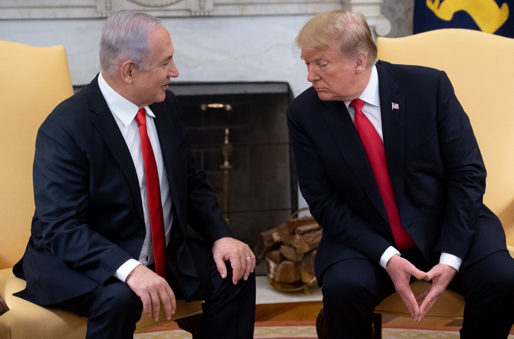 Trump and Israeli Prime Minister Benjamin Netanyahu meet at the White House on 25 March (AFP)