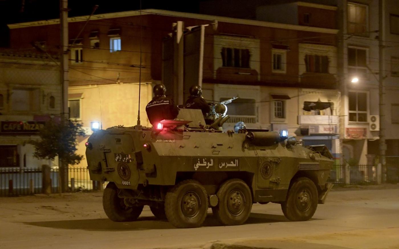 Photo legend: Members of the Tunisian National Guard in their armoured vehicle amid the clashes between protectors in Ettadhamen district, Tunis, on 17th January 2021 (AFP)