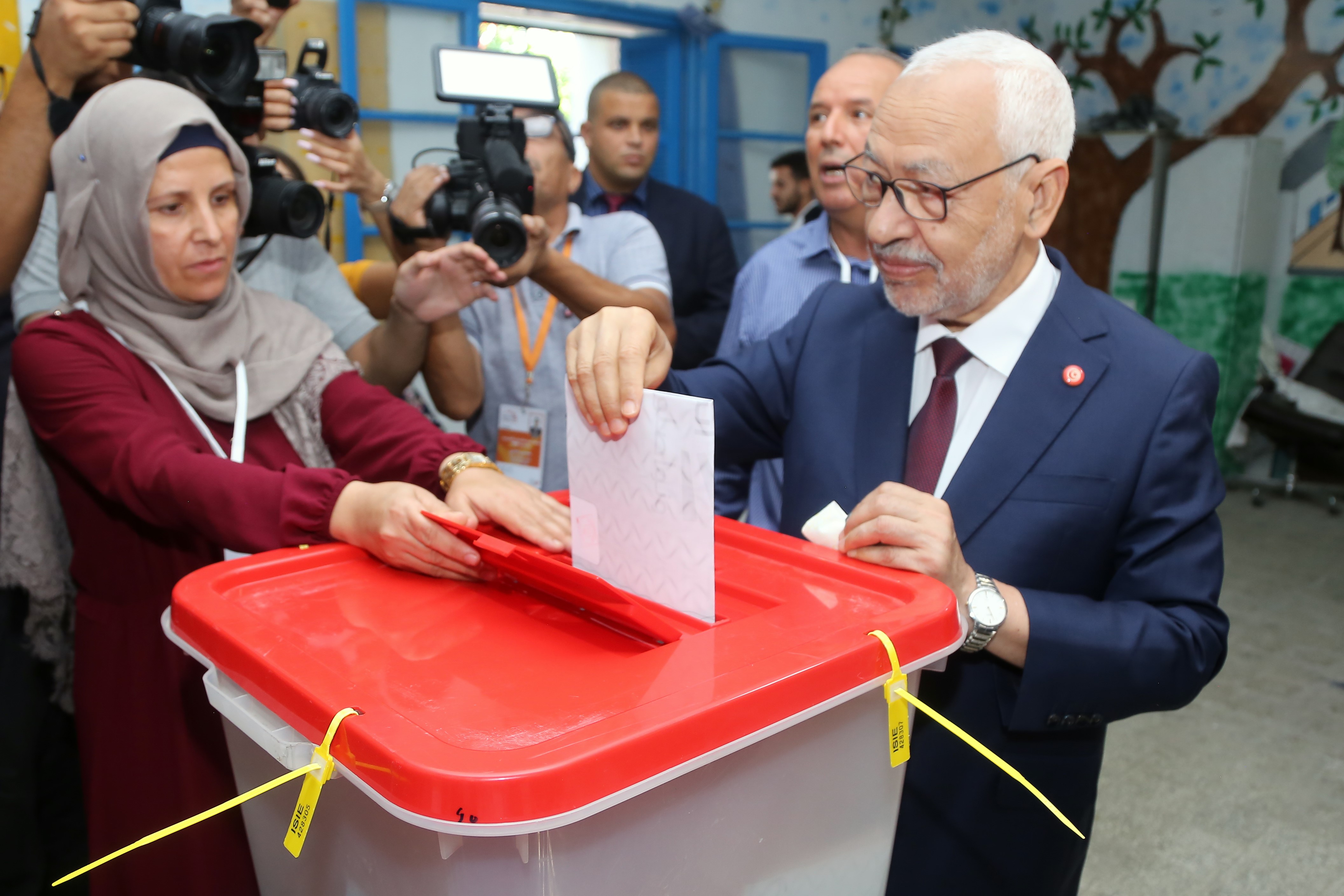 Ennahdha Party leader Rached Ghannouchi casts his ballot at a polling station in the capital Tunis on October 6, 2019, 