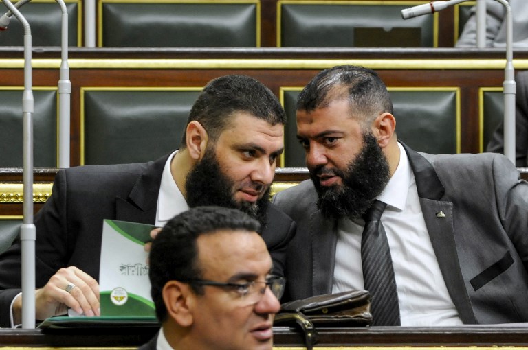 Members of Egypt’s parliament attend a session to deliberate the proposed constitutional amendments in Cairo on 14 February (AFP)