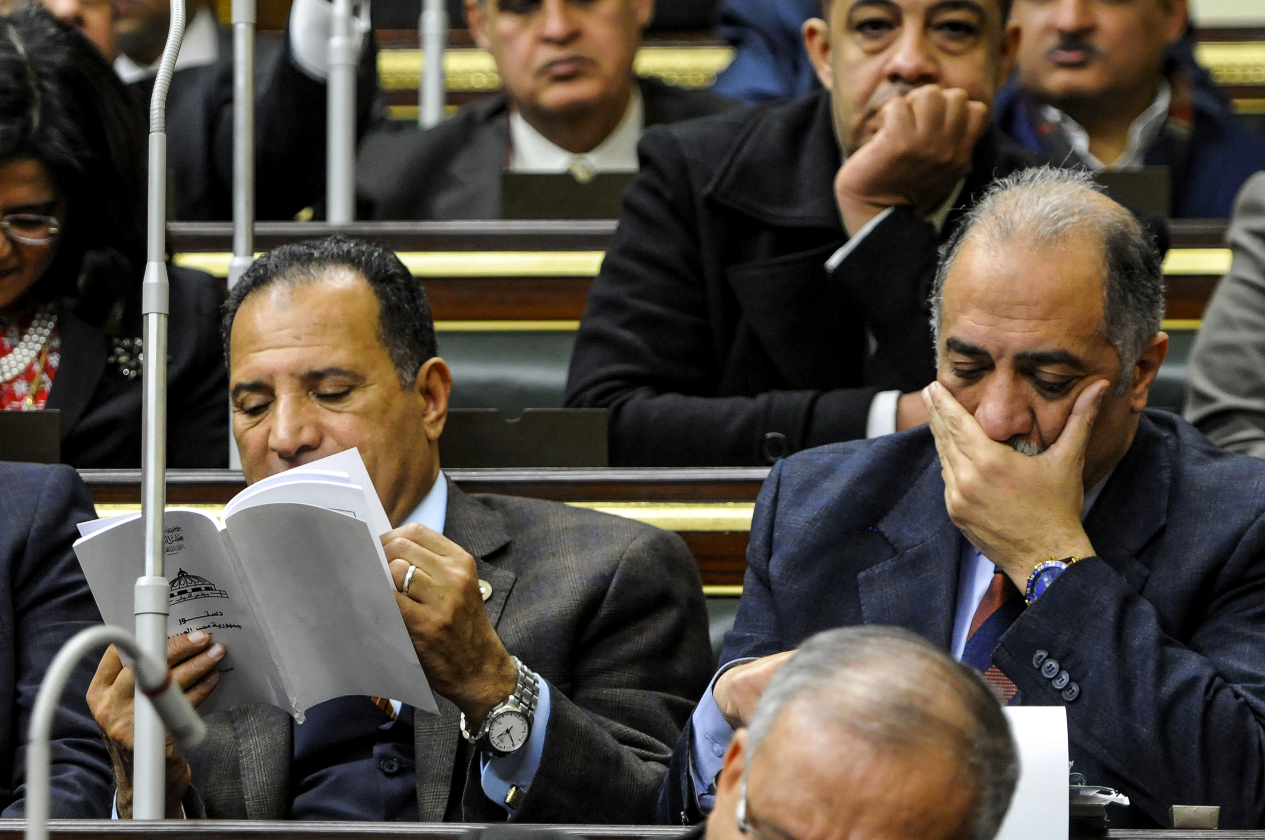 Members of Egypt's parliament attend a plenary session to deliberate the proposed constitutional amendments (AFP)