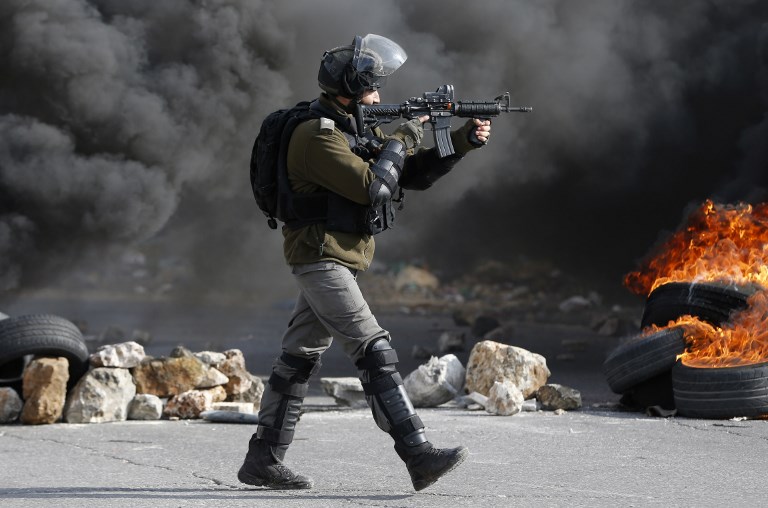 An Israeli border guard is pictured during clashes in the occupied West Bank on 12 January 2018 (AFP)