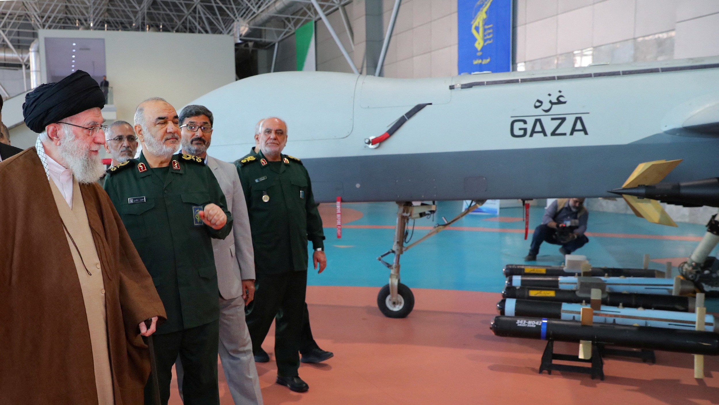 Iran's Supreme Leader Ali Khamenei looks at an Iranian drone during his visit to the IRGC Aerospace Force Achievements exhibition in Tehran, 19 November (Reuters)
