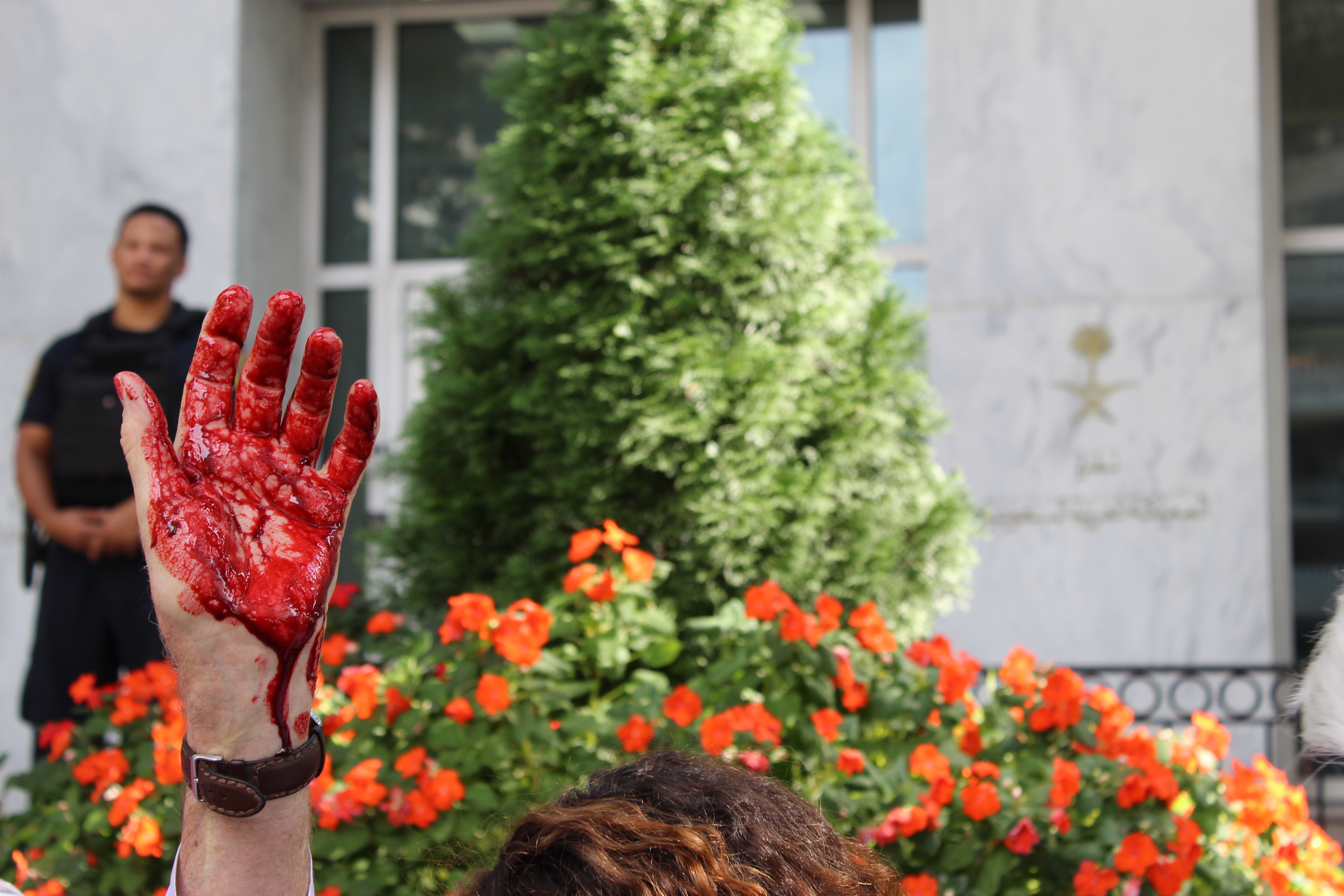 One protester dressed up like Saudi's MBS, covering his hands in blood (MEE/Sheren Khalel) 