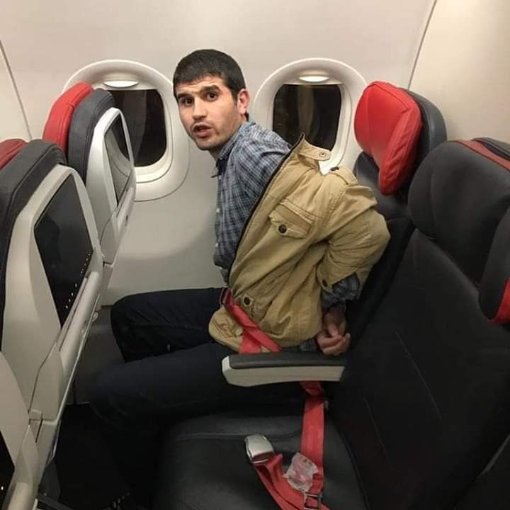 A handcuffed Abdelhafiz on a Turkish Airlines flight to Cairo on 18 January 2019