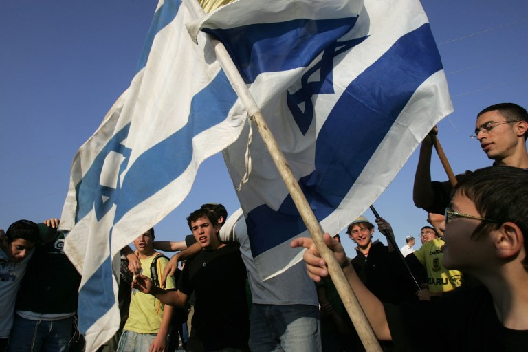 Israeli activists hold a pro-settlement demonstration in 2007 (AFP)
