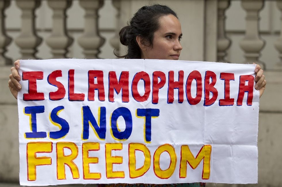 A protester make a statement against Islamophobia in London in 2016 (AFP)