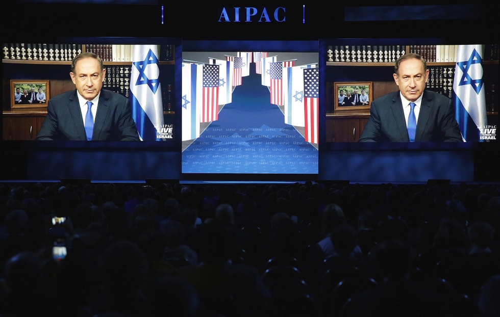 Benjamin Netanyahu speaks via a video link to AIPAC policy conference in Washington, 27 March  (Reuters)