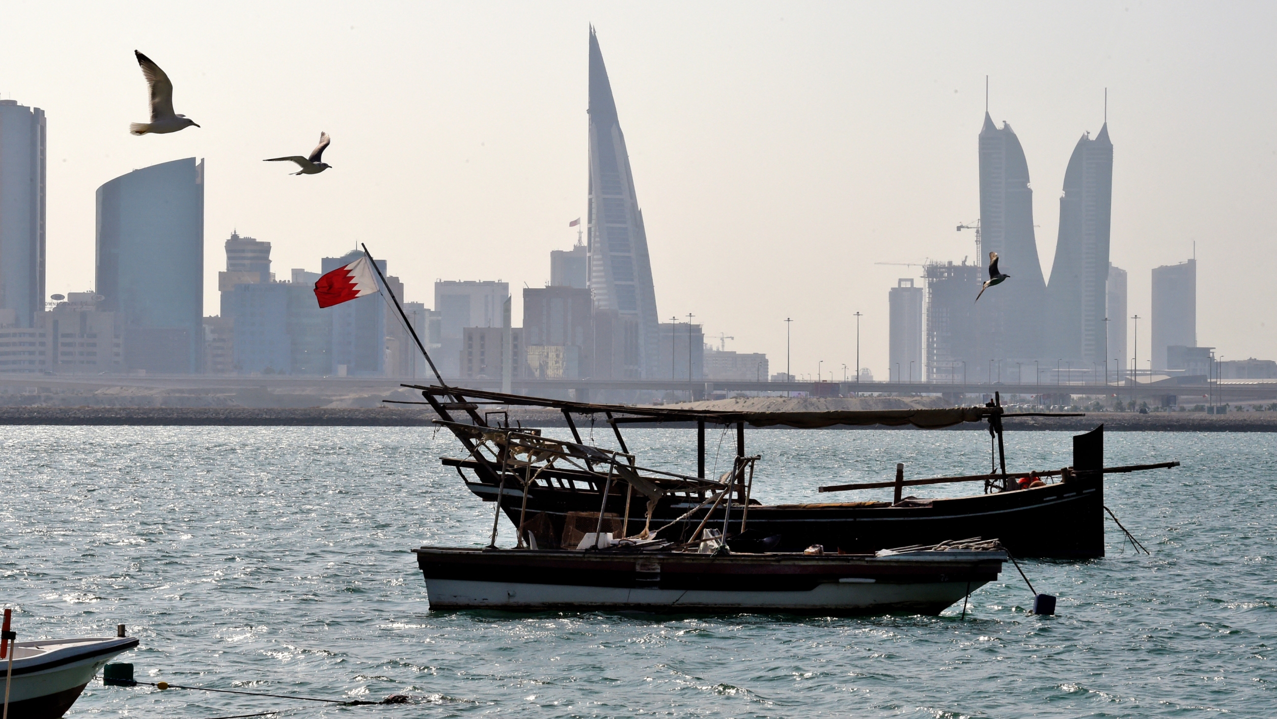 Fishing boats are pictured at the Muharraq island shoreline north of the Bahraini capital Manama on 20 December 2020 (AFP)