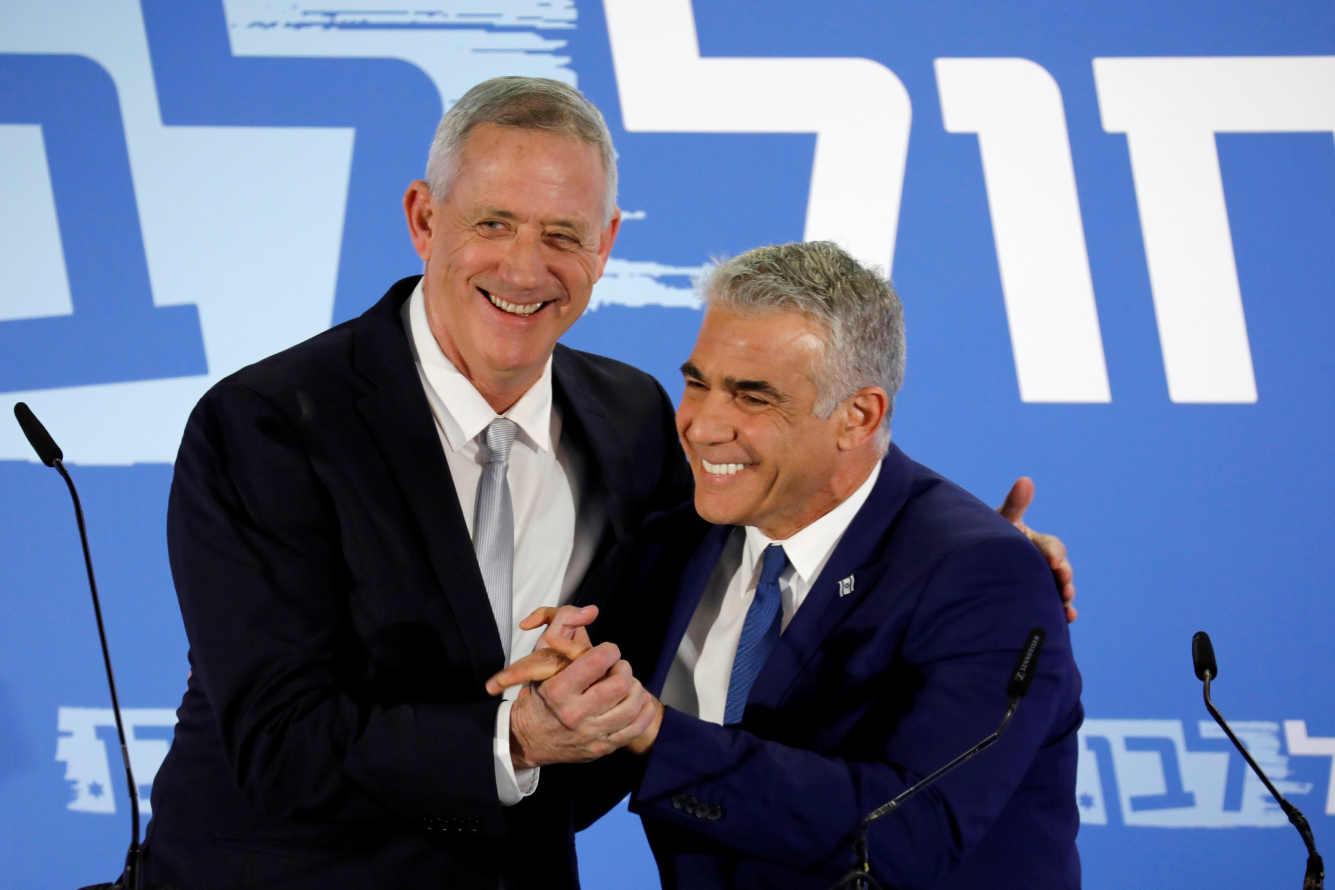 Benny Gantz, head of Resilience party and Yair Lapid, head of Yesh Atid, hold a news conference to announce the formation of their joint party (Reuters)