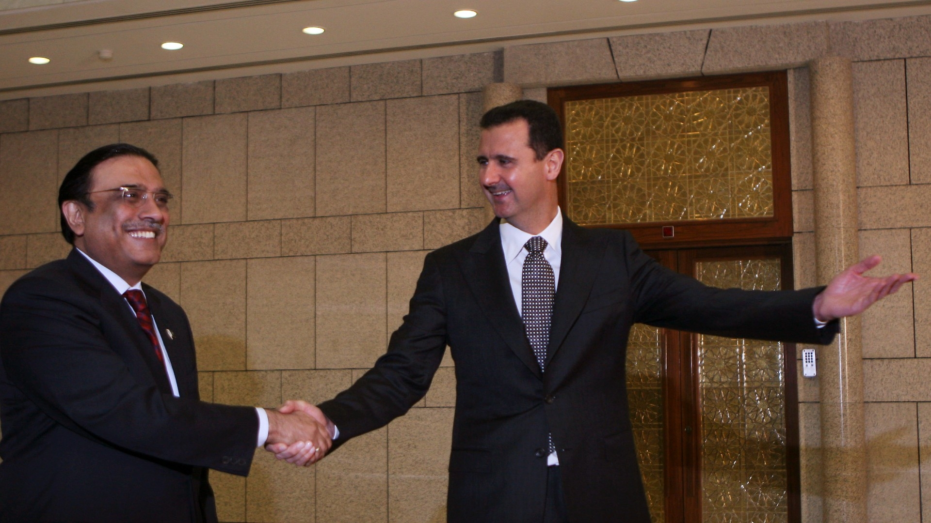 Syrian President Bashar Assad, right, welcomes his then-Pakistani counterpart Asif Ali Zardari at the presidential palace in Damascus in 2010 (AP)