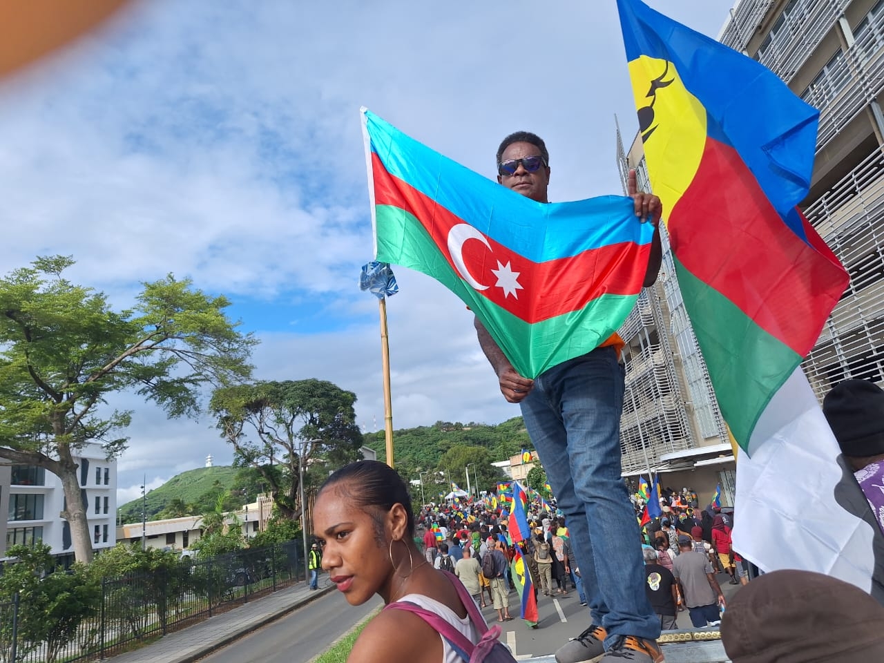 Protestors hold the flags of Azerbaijan and New Caledonia in this picture shared on X, formerly known as Twitter, in 29 March 2024 (Screenshot)