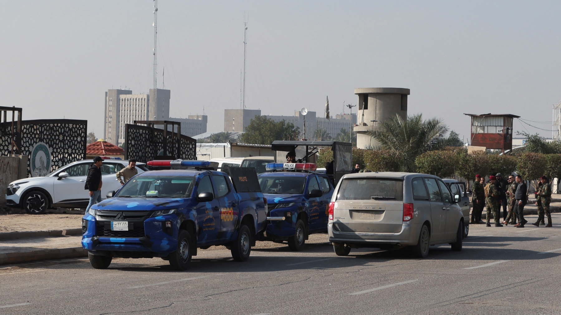 police vehicles near drone stike site in baghdad