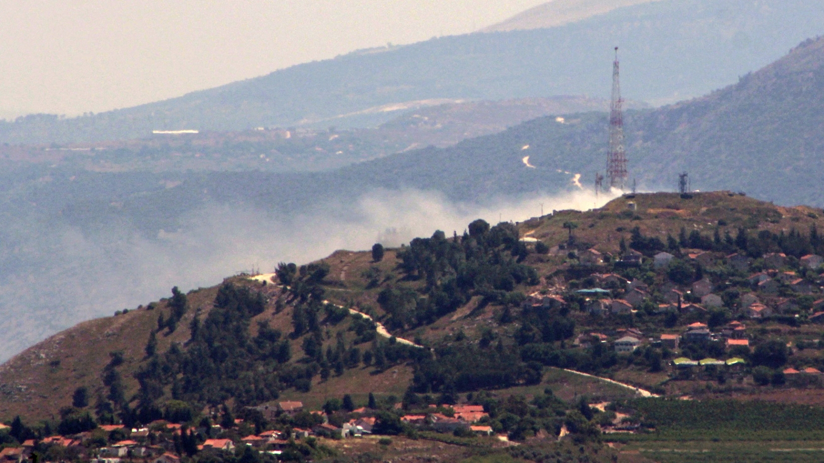 Smoke rising above the northern Israeli town of Metula following an attack from Lebanon amid cross-border fighting between Israel and Hezbollah on 16 May 2024 (Rabih Daher/AFP)
