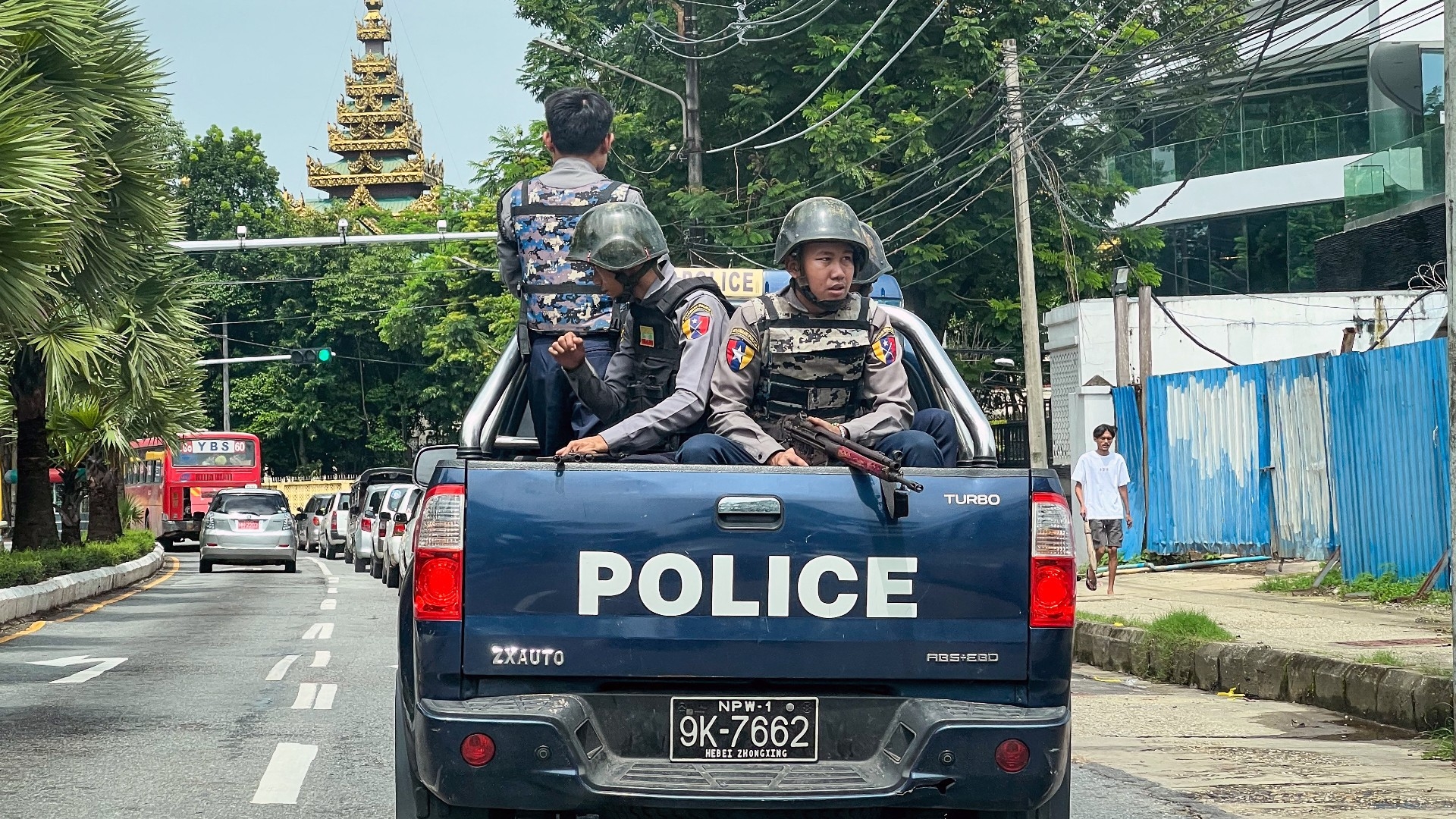 Police patrol on a street in Yangon, Myanmar, on 19 July 2023, on the 76th Martyrs' Day (AFP)