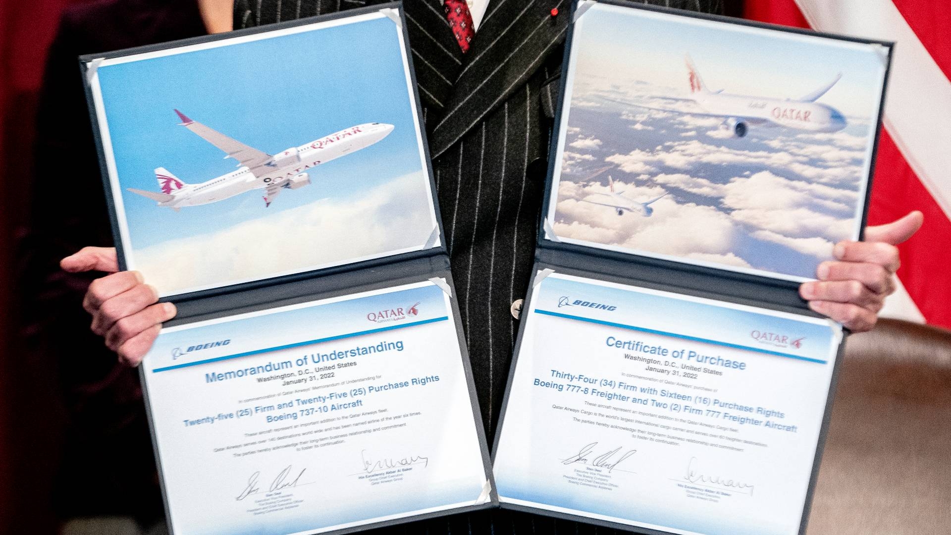 Akbar Al Baker, Qatar Airways CEO, displays certificates following a signing ceremony with Boeing in Washington on 31 January 2022.