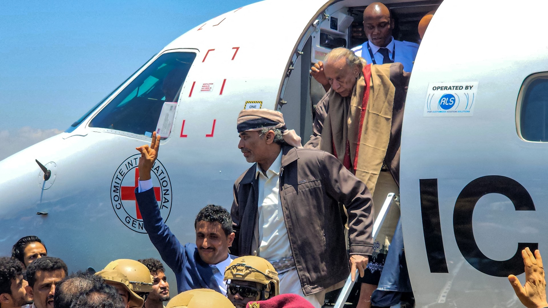 Yemeni negotiator Yasser al-Haddi (bottom), former defence minister Mahmoud al-Subaihi (C) and Nasser Mansour Hadi (top), the brother of the former Yemeni president, arrive at Aden's airport in Yemen's southern city on 14 April 2023 (AFP)