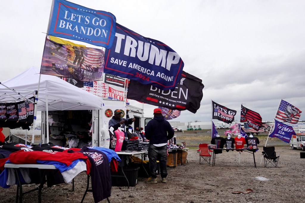 Trump supporters shop for merchandise at an event in Nebraska on 29 April 2022 (AFP)