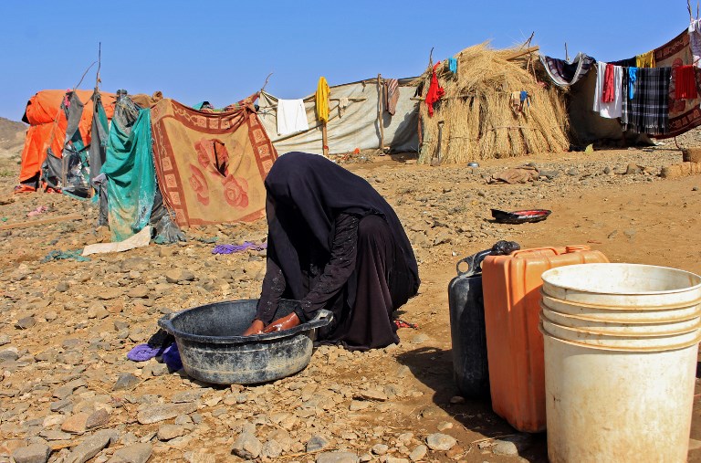 A Yemeni woman, displaced by fighting elsewhere in the country, in a camp for displaced people in Hajjah (AFP) 